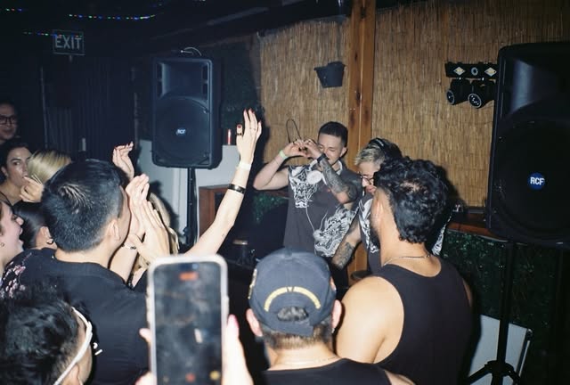 A packed Sonido Melbourne dancefloor surrounds the DJ booth